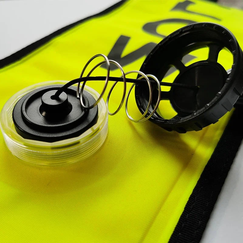 Colorful inflatable diving SMB buoy in orange and fluorescent colors for diver visibility and safety at surface